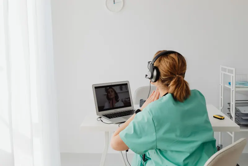 Health professional taking a virtual class on her laptop